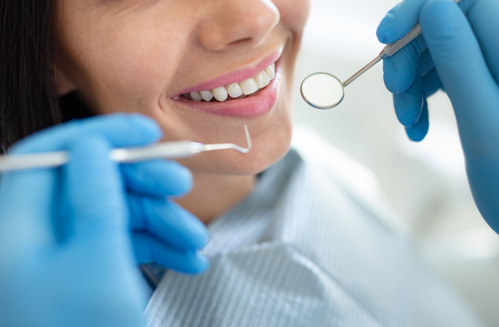 Close-up of a patient receiving a dental examination.