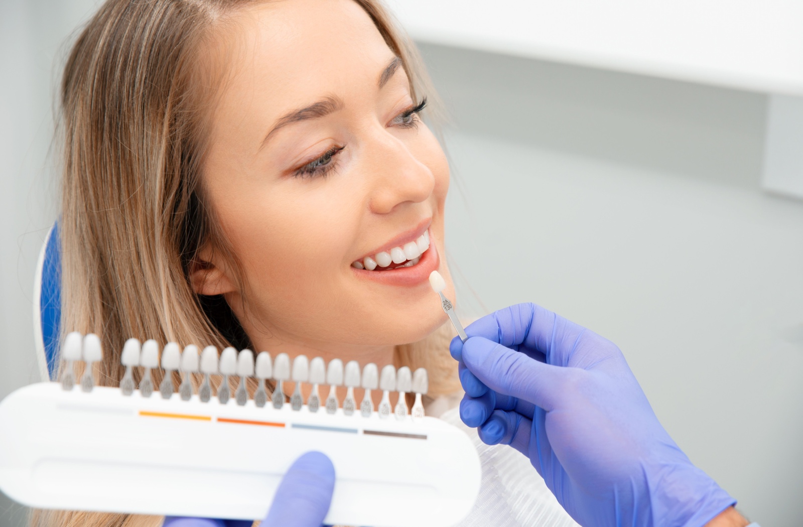 Patient selecting a shade for dental veneers in Chilliwack, BC